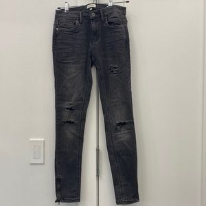 Black jeans with cutouts. Zippers on bottom sides. Excellent condition.